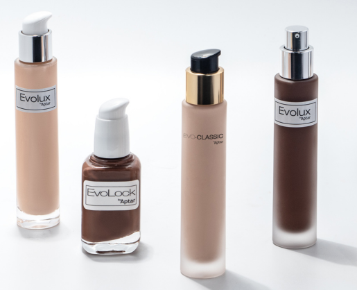 Four cosmetic foundation bottles in different shades, each with a unique reliable cosmetic pump labeled Evoclassic. The bottles are arranged neatly on a white surface.