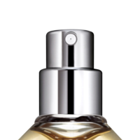 Close-up of a shiny silver High-Performing Fragrance Pump named VP4 on top of a transparent bottle with golden liquid, set against a plain white background.