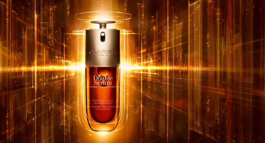 A close-up image of Aptar Beauty's custom solution for Clarins Double serum, a patented custom double-chamber packaging allowing two-in-one dispensing of the iconic serum, with a progressive dosage actuator.