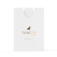 A white rectangular ultra-flat fragrance sampling pouch with a rounded top opening, displaying the gold and black IMAGIN by Aptar logo and the word SAMPLING below. The design is minimalistic and clean.