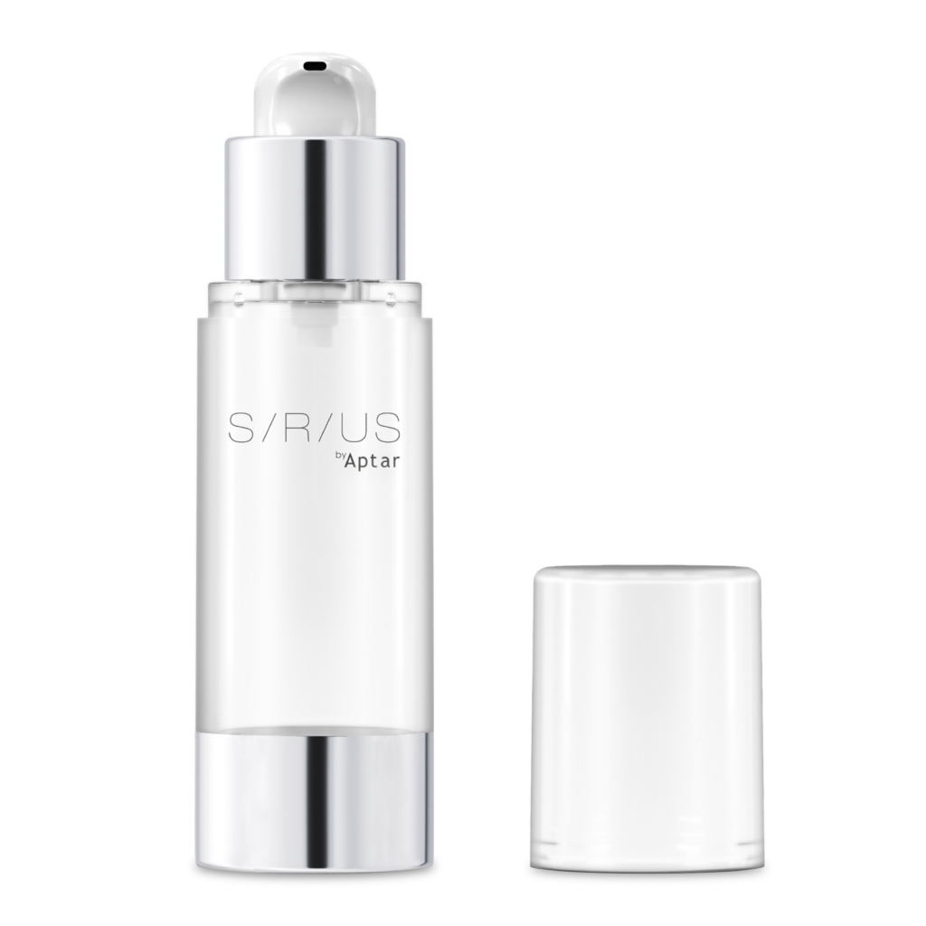 A clear classic premium airless packaging with a silver base and dispenser, labeled SIRIUS by Aptar, stands upright next to its transparent, cylindrical cap on a plain white background.