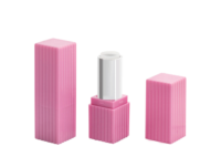 A pink, rectangular, ribbed non guided mini lipstick packaging is shown open in the center, with the cap placed beside it on the right and the closed tube on the left, all on a white background.