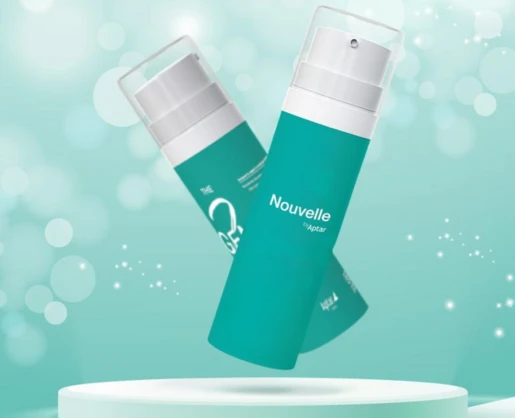 Two teal cylindrical plastic bottles labeled Nouvelle by Aptar, a customizable airless packaging option, are displayed on a white circular platform with a soft, teal bokeh background and floating light particles.