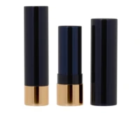 Trio of navy blue and gold non-guided lipstick packaging is arranged upright: one closed, one open to show the lipstick tube and its cap beside it.
