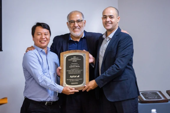 Three Aptar Employees being recognized for outstanding safety performance in Maringá, Brazil