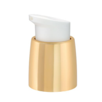 A picture of a cosmetic pump standing alone on a white seamless background. The actuator is white and the collar is gold.