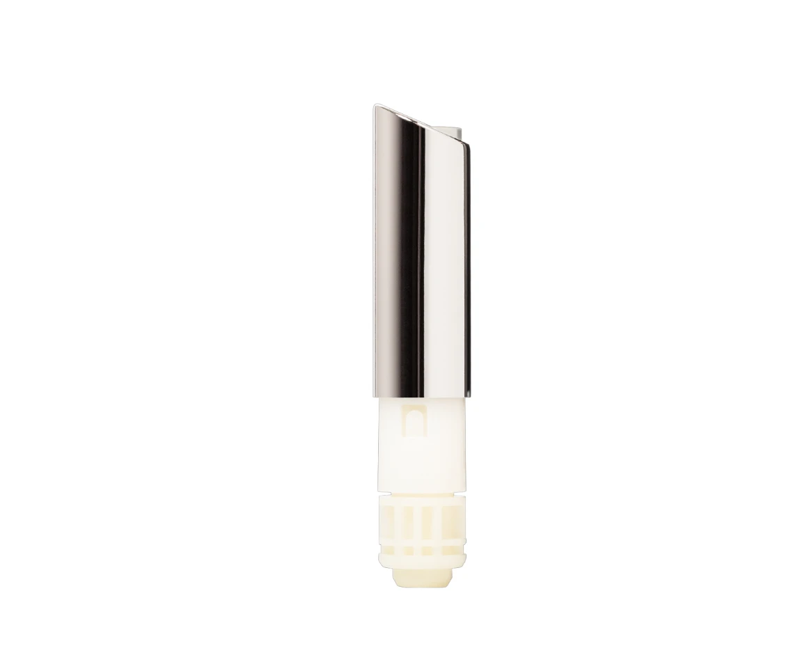 A close-up of a cylindrical, silver and white lipstick catridge, featuring a guided lipstick mechanism, standing upright against a plain white background.