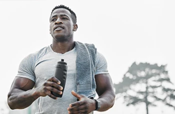 Cropped shot of a handsome young male athlete out for an early morning run