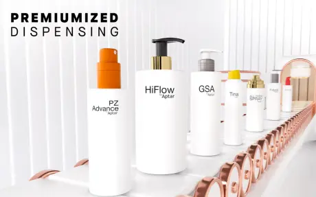 White dispensing systems on bottles and full packaging on a conveyor belt with a white industrial background and Premiumized Dispensing title with Aptar Beauty logo