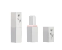 Two silver non guided mini lipstick packaging with black floral patterns are shown on a white background. One is closed, and the other is open with its cap beside it, showing the lipstick inside.