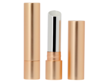 Three metallic gold cylindrical guided lipstick packaging cases are shown: one closed, one open revealing silver lipstick, and one with the cap removed and placed beside it, all standing upright on a white background.