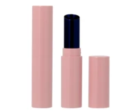 A pink cylindrical guided lipstick packaging with the cap removed and placed beside it, revealing a dark-colored lipstick inside.