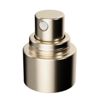 Close-up of a gold collar component from PAV, Aptar Beauty's customizable spray pump with its matching actuator,positioned against a plain white background.