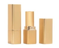 A gold and rectangular non-guided lipstick packaging is shown,with one version closed,and one that reveals the lipstick tube and the cap removed and placed beside it. 