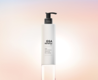 A white pump bottle labeled GSA Advance stands upright on a clear base against a soft, gradient pastel background