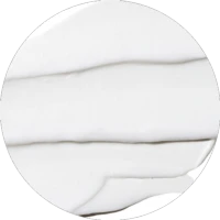 A picture of lotion in a circular frame, depicting that bag-on-valve is compatible with this type of formula