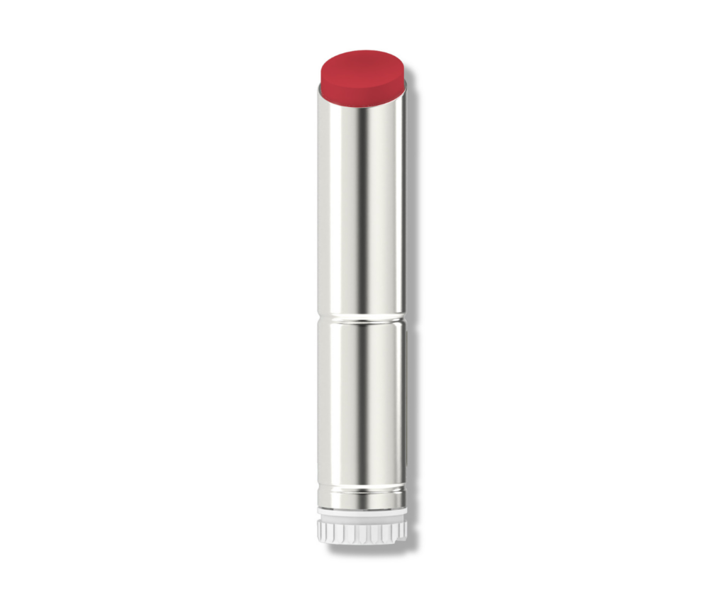 A silver lipstick tube featuring a Guided Lipstick Mechanism stands upright with its cap removed, revealing a red lipstick bullet against a white background, part of the Stylist Guided Lipstick Mechanism collection.