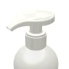 A close-up of a white plastic bottle with a Dispensing Pump with Metal-Free Pathway labeled GSA, commonly used for soap, lotion, or sanitizer, against a plain white background.