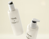 Two white plastic pump bottles with the labels Future Airless PET are floating against a pale beige background. The bottles feature minimalist black text, white pump tops, and utilize recyclable PET airless packaging.