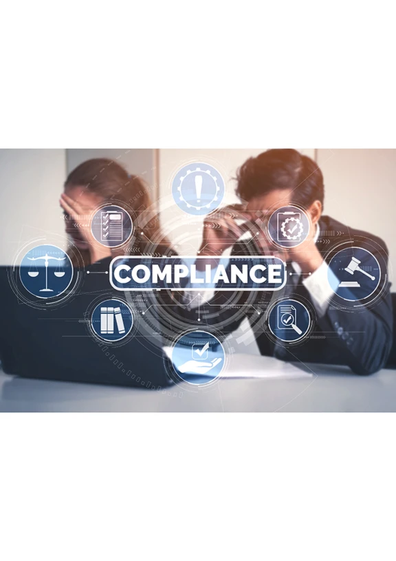 Man and woman at desk with laptops assessing the complex drug regulatory requirements for inhalers.