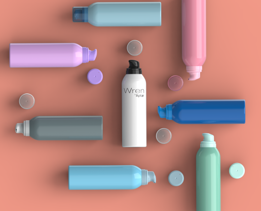 A vibrant arrangement of assorted pastel and bright-colored bottles featuring aerosol actuators for mousse and lotion, artistically scattered across a soft peach background. At the center, a sleek white bottle labeled 'WREN' stands out.