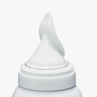A close-up of a white plastic bottle featuring an aerosol actuator for whipped formulas labeled Aspire, set against a plain white background.