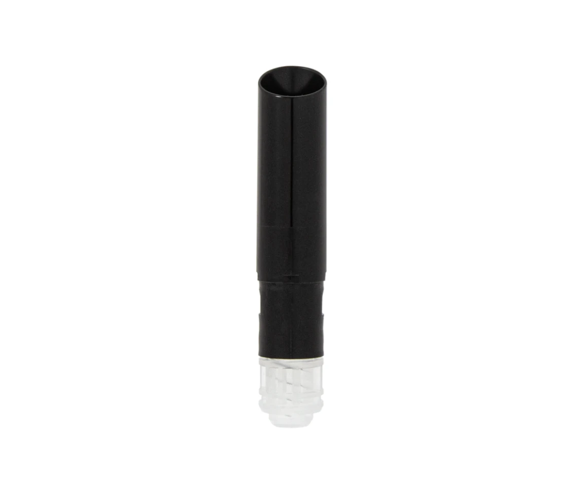 A black plastic guided lipstick mechanism with a transparent end stands upright against a plain white background. Its slim and elegant format features a slanted bullet shape for precision.
