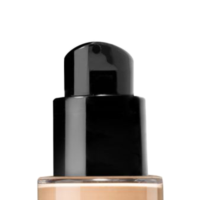 Close-up of a versatile cosmetic pump named Metropolitan atop a black dispenser bottle of liquid foundation, with beige product visible inside the transparent lower section, isolated on a white background.