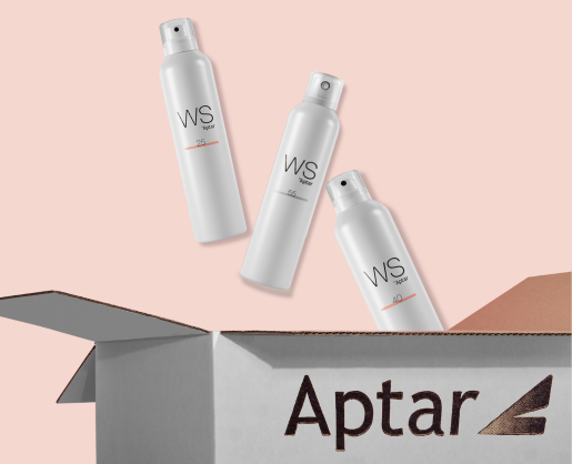 Three white bottles labeled WS40, WS55, and WS25 float above an open Aptar-branded cardboard box on a soft pink background. The WS25 bottle features a modern aerosol actuator.