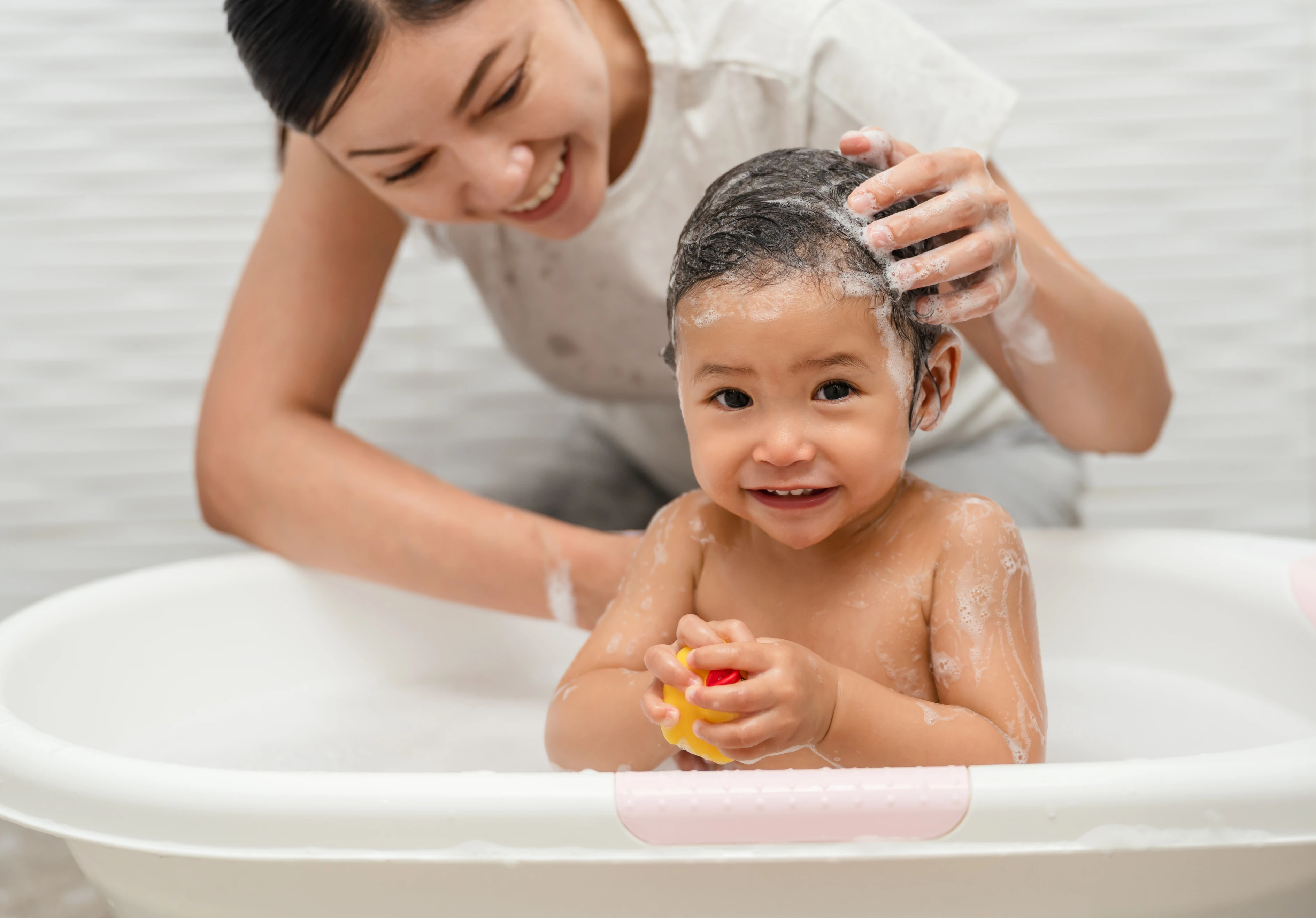 Airy-Woman Giving Child Bath.jpg