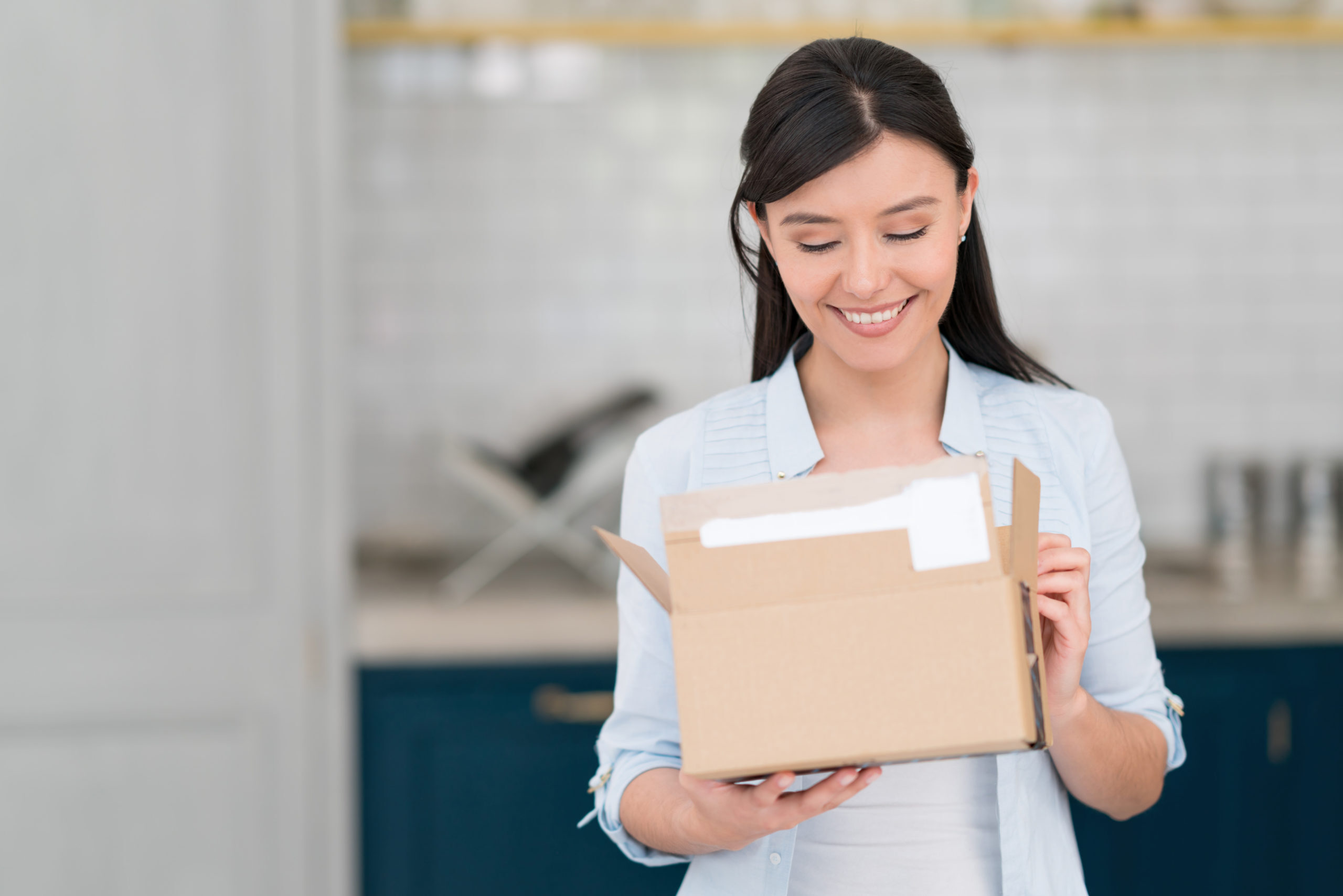 Woman getting a package on the mail