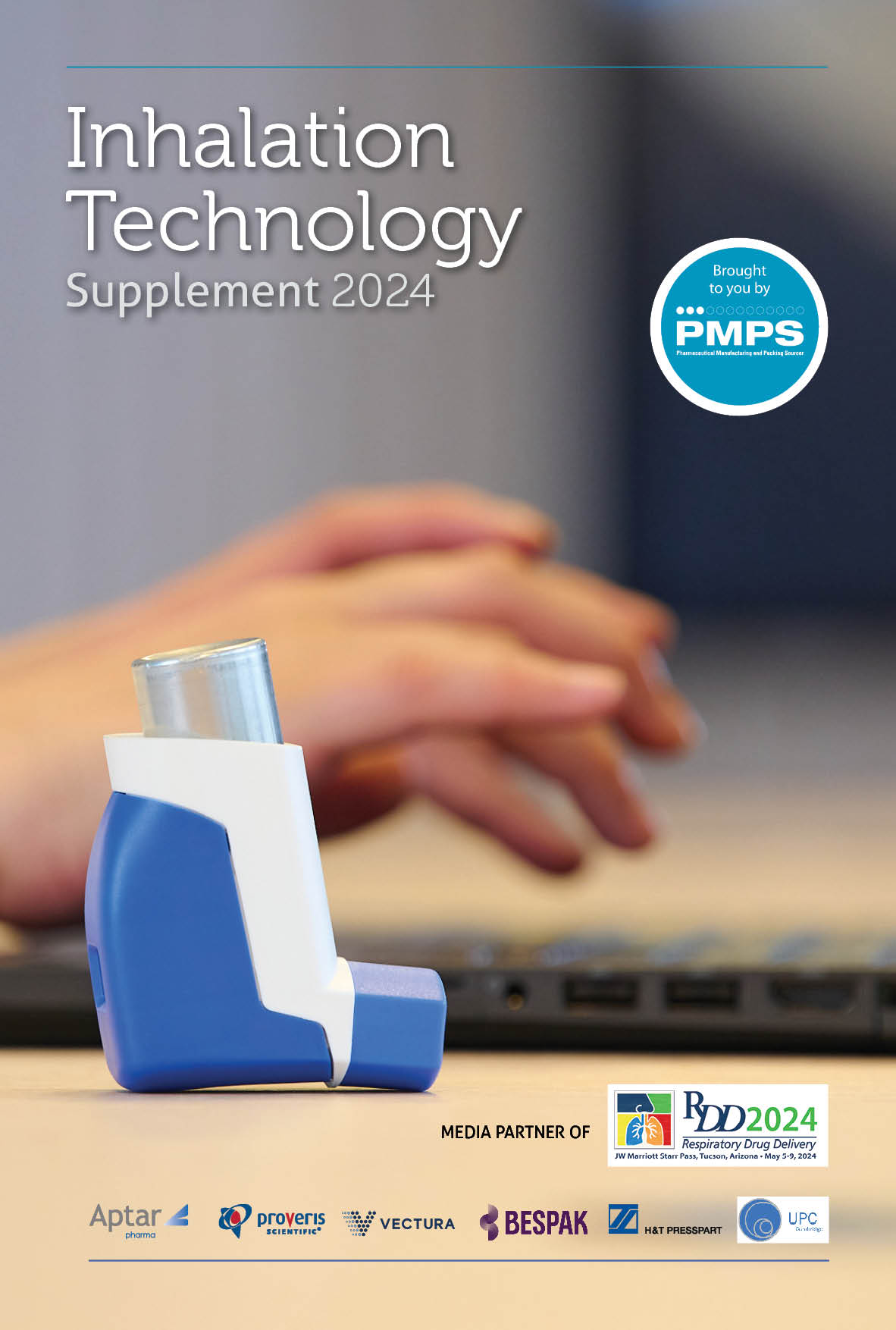 Blue inhaler with hands typing on a laptop in the background