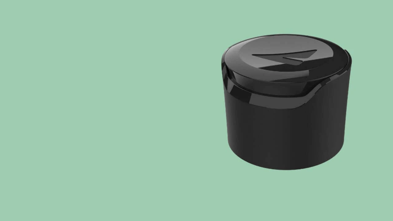 Embrace personal care closure in black, closed position on green background