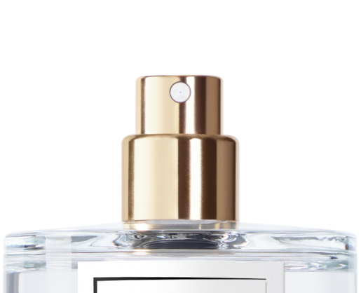 Close-up of the top of a clear glass perfume bottle featuring a shiny gold High Quality Prestige Fragrance Pump named Sensea and a white label partly visible on the front.