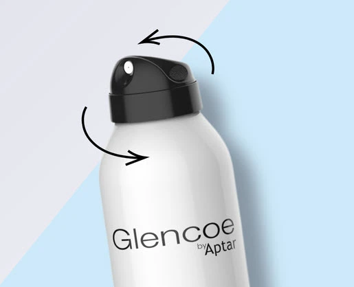 A white aerosol can with a black actuator labeled Glencoe by Aptar is shown against a blue and light purple background. Black arrows highlight the function of its hoodless aerosol actuator nozzle.