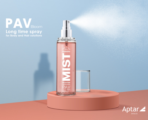 A pink spray bottle labeled PAV MIST which is a customizable spray pump, sprays a fine mist to the right. The bottle sits on a round, peach platform against a blue and peach background. Text reads: PAV Bloom Long time spray for Body and Hair solutions.