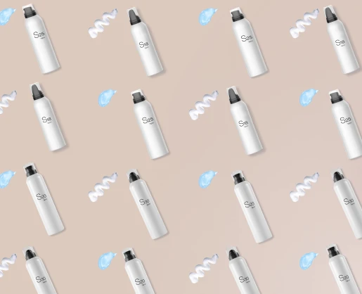 Close-up of white bottles with black caps labeled S25, S18, and S30, arranged diagonally on a beige background. The S18 bottle features an inverted actuator designed for foaming formulas. Swirls of white and blue cream are artistically placed between the bottles, adding a dynamic and textured visual element.