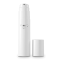 A white cylindrical bottom fill airless packaging is labeled macro by Aptar and stands upright with its matching cap placed beside it on a plain white background.