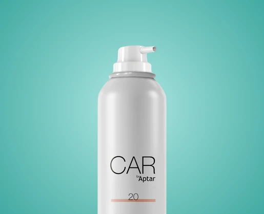 A white aerosol with an aerosol actuator featuring an extended nozzle on top, labeled CAR by Aptar and the number 20 near the bottom, set against a teal background.