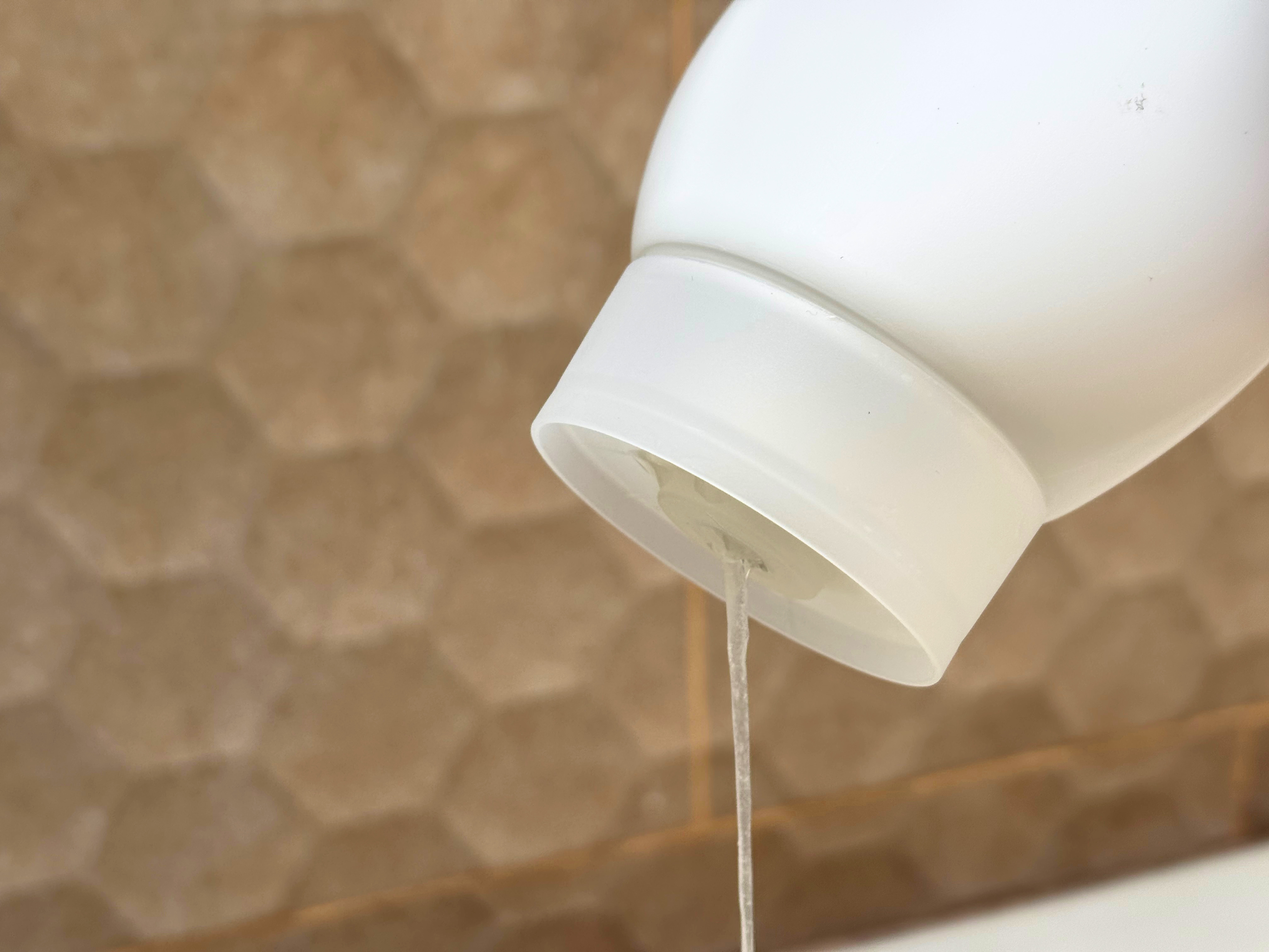 Inverted Lidless Closure dispensing in shower Cleo