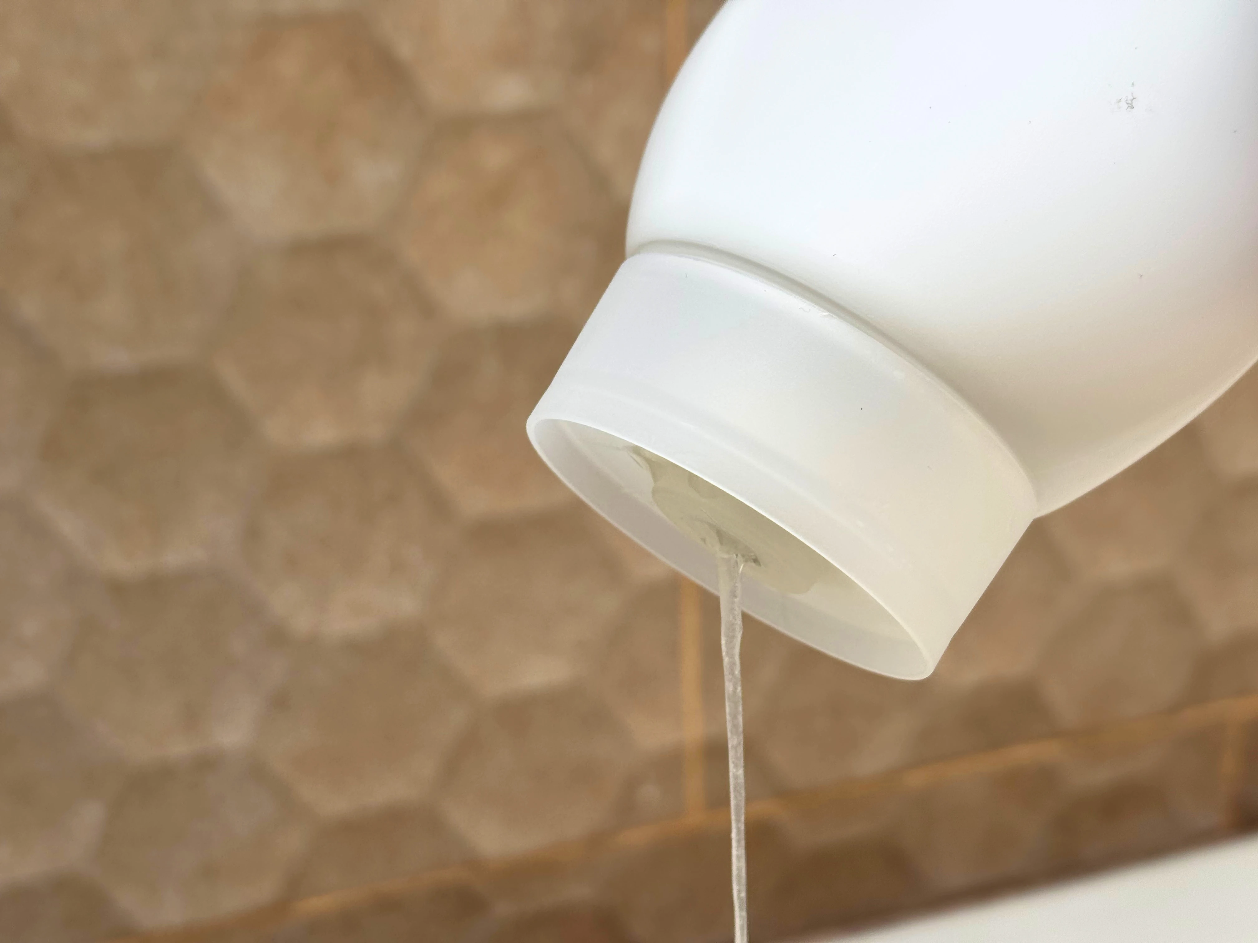 Inverted Lidless Closure dispensing in shower Cleo