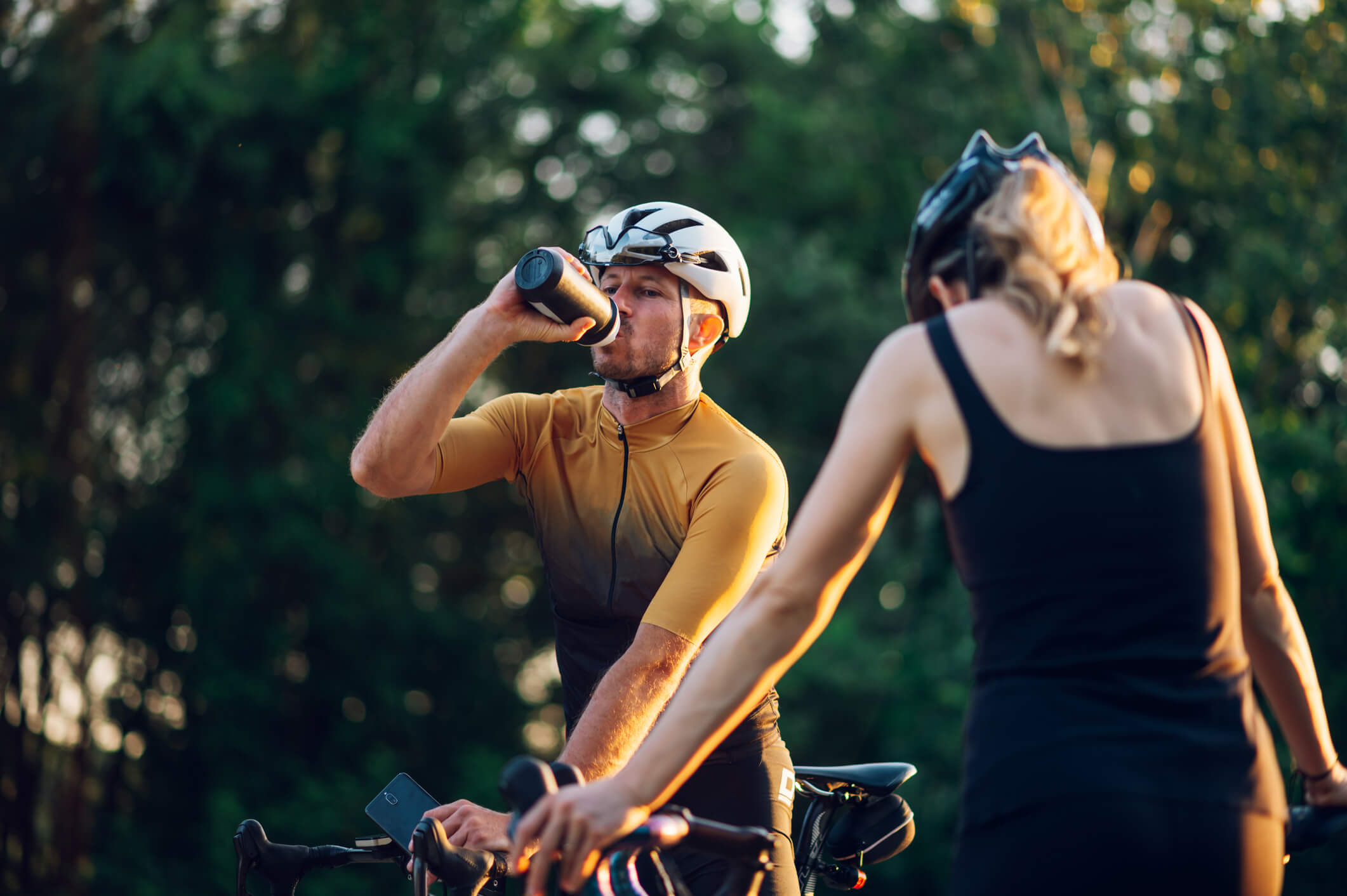 Couple riding bikes, full size