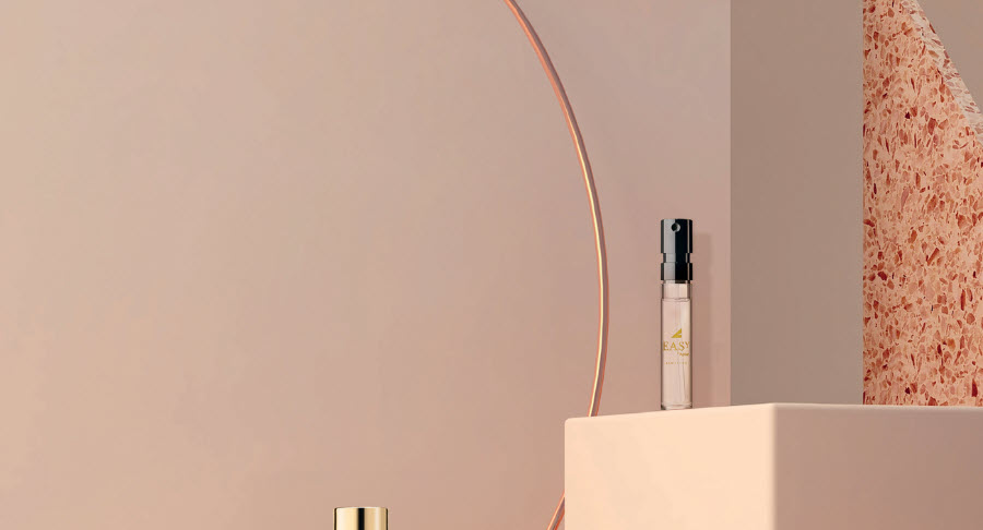 A minimalist scene with a small perfume bottle on a square pedestal and another spray bottle in the background, evoking elegant fragrance sampling labeled Easy Spray, set against a soft beige wall with a copper arc and textured accent.