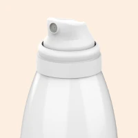 Close up of Aptar Beauty Meridian Aerosol Spray Actuator White Finish on Beige Background