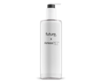 A tall, rectangular white bottle with a black pump dispenser. The label reads Future Airless PET in black text, highlighting a collaboration focused on recyclable PET airless packaging.