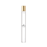 A clear, slim glass perfume bottle with a gold fragrance pump, labeled STILO in black text, features refillable fragrance mini packaging and stands upright against a plain white background.