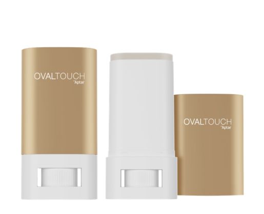 Two OvalTouch face sticks in gold and white, one without the cap, on a white background.