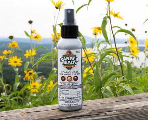Aptar Beauty's Euromist 2-Way Spray Pump is featured on a Ranger Ready Tick Spray bottle, The bottle is sitting on a wooden railing.