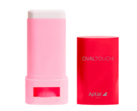 Pink on-the-go oval face stick labeled Oval Touch with a white a red cover featuring Aptar beauty branding, designed for portable cosmetic application, shown against a white background.