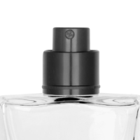 Close-up of the top of a clear glass spray bottle with a black Color Code PCR fragrance pump nozzle, set against a plain white background.